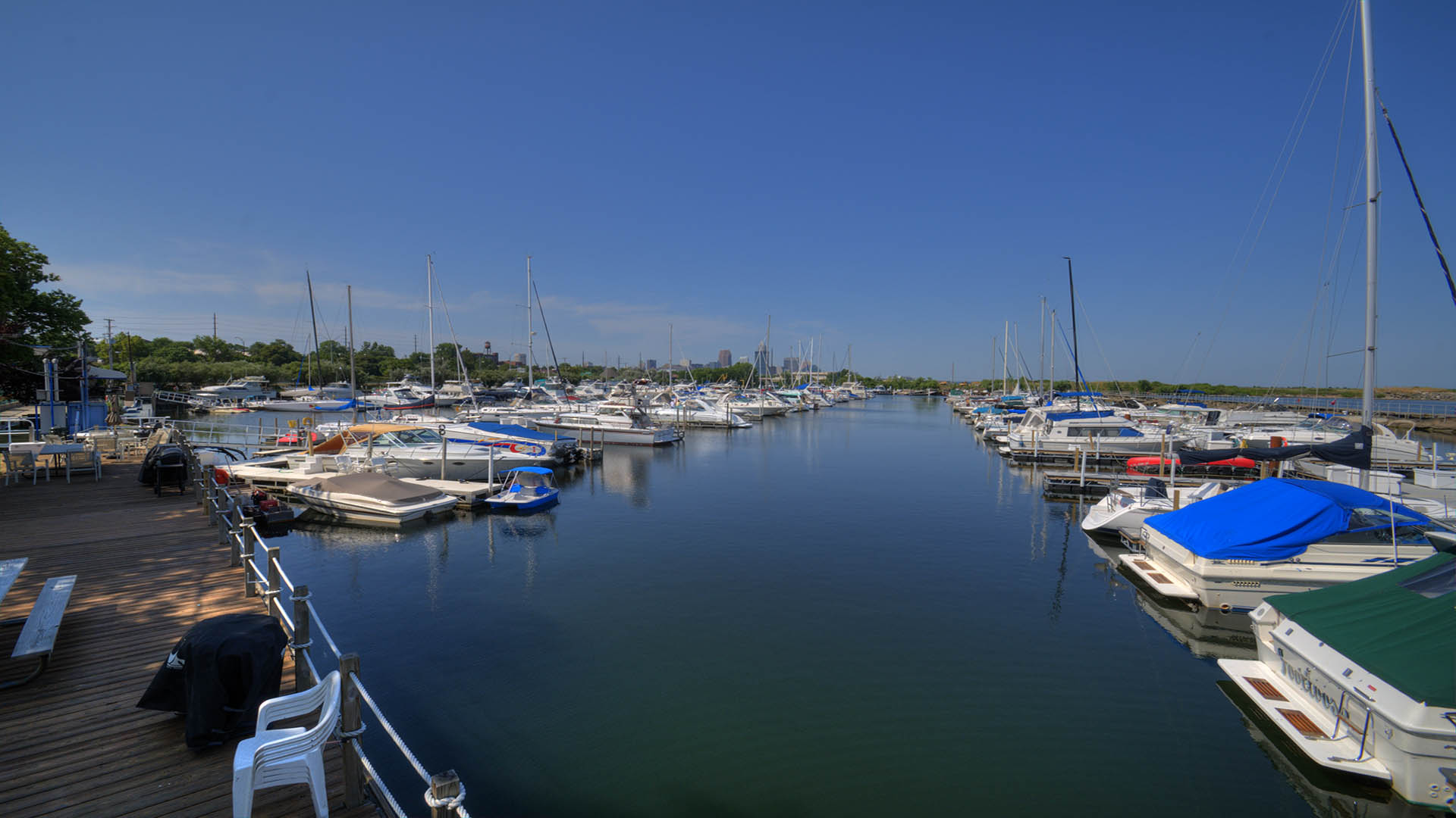 Protected Lakeside Yacht Club harbor with docks and boats on Lake Erie